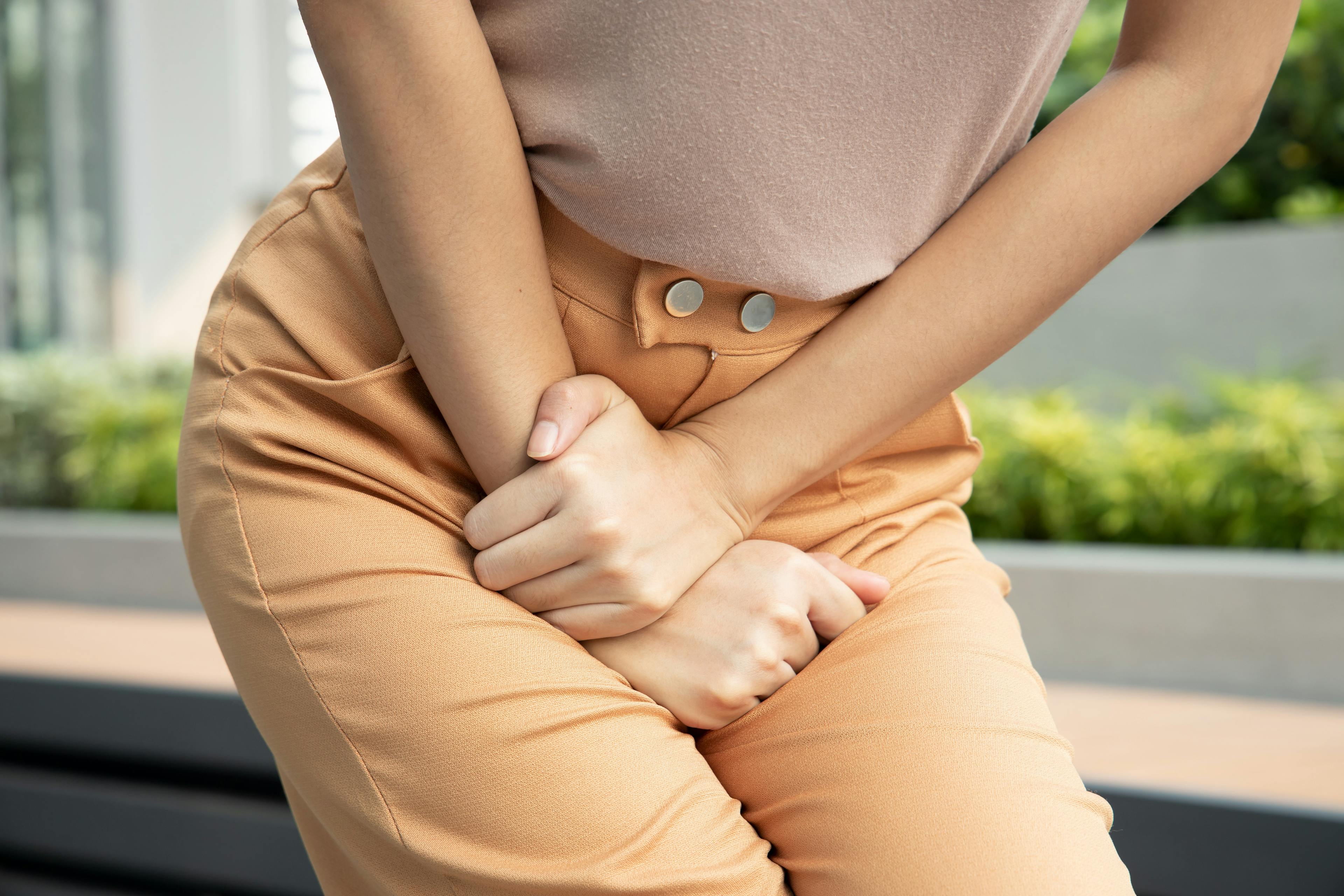 Women with overactive bladder symptoms holder her pee. 
