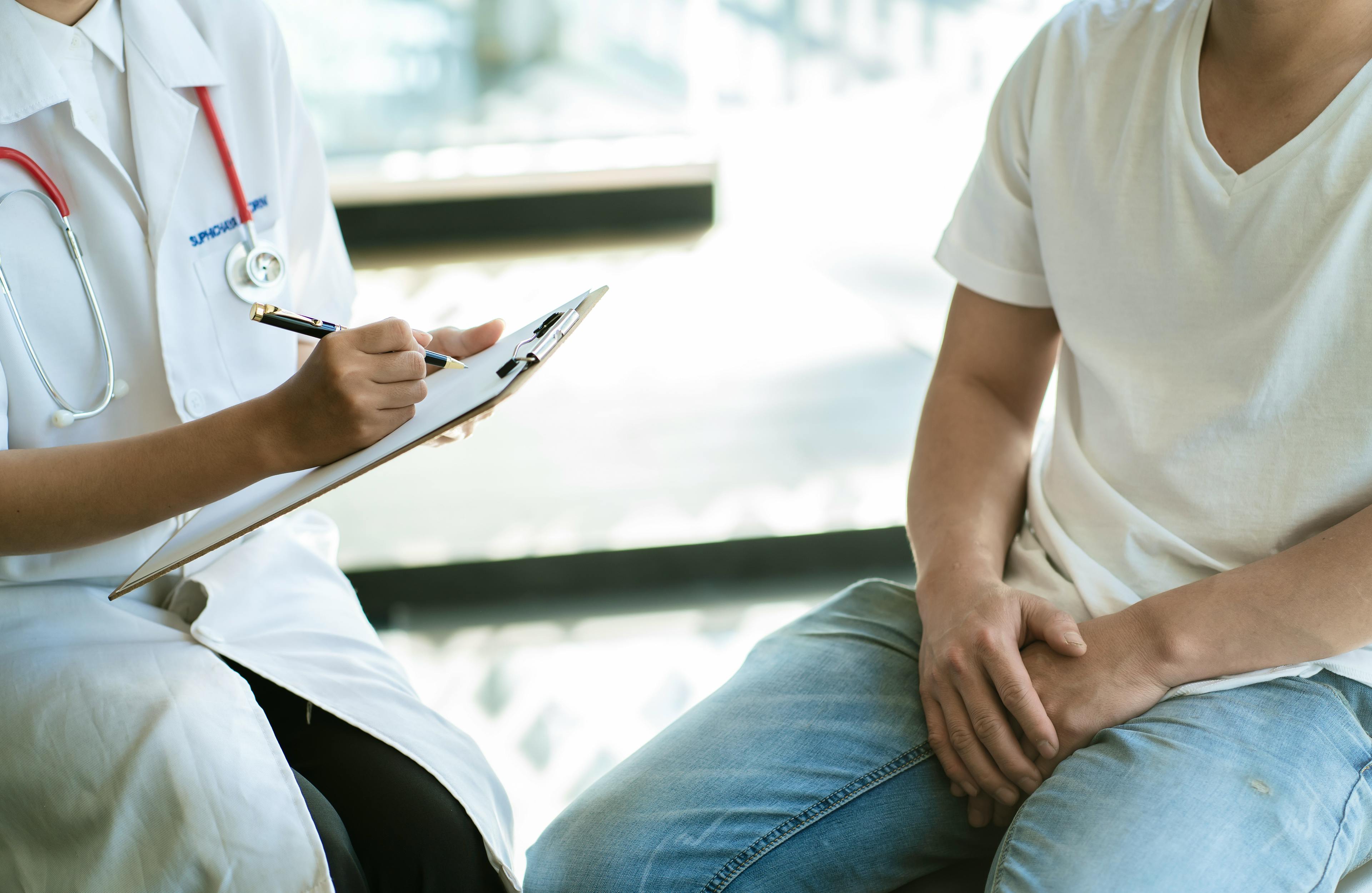 Man with urinary problem consulting with doctor