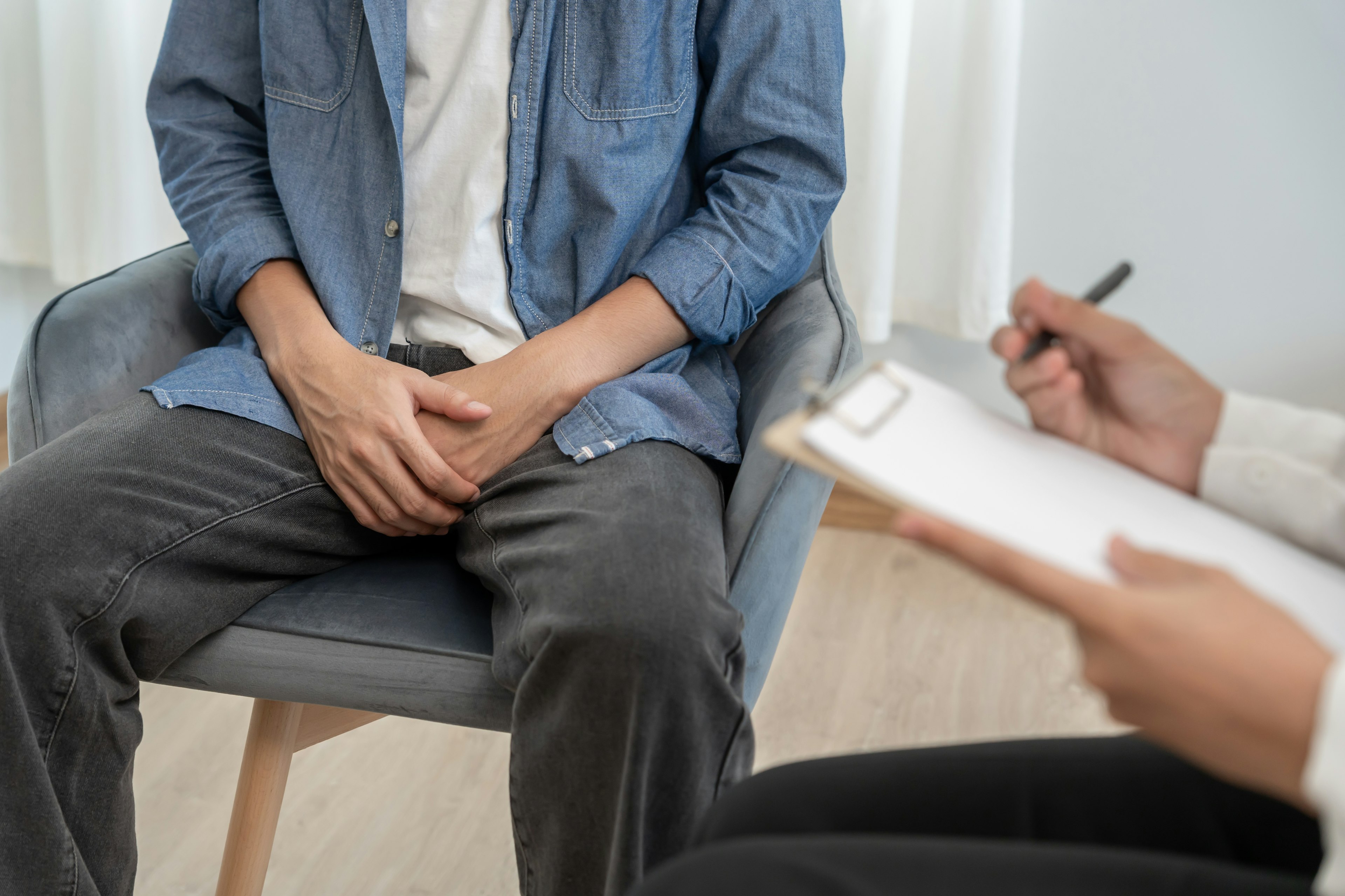 Man consulting doctor about prostate health.