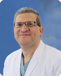 Board-certified cardiologist, Dr. Bahaeddin Shabaneh, pictured in his white coat.
