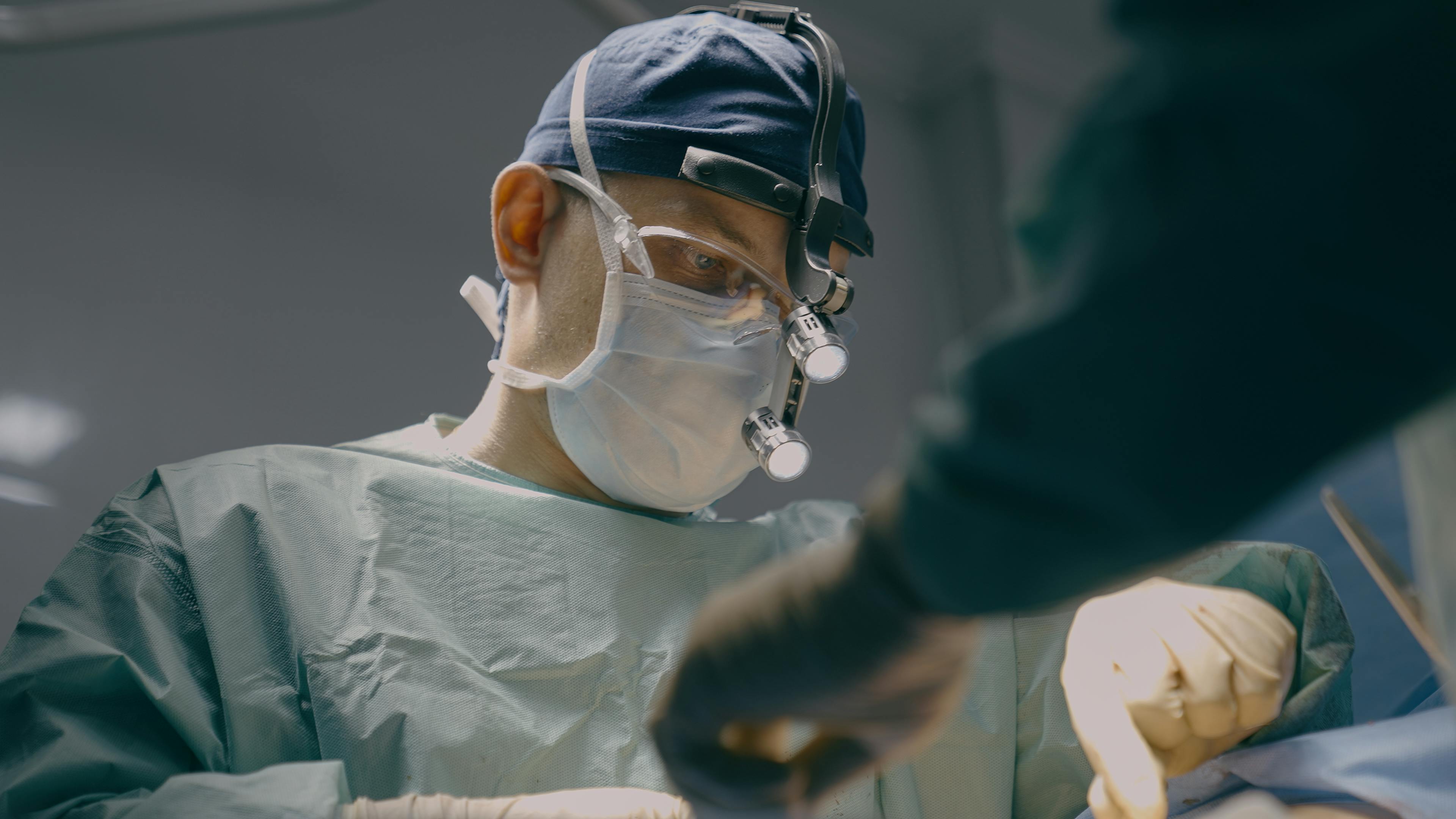 Doctor performing surgical procedure.
