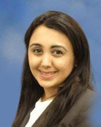 Faiza Malik, MD, family medicine doctor posing for her headshot.