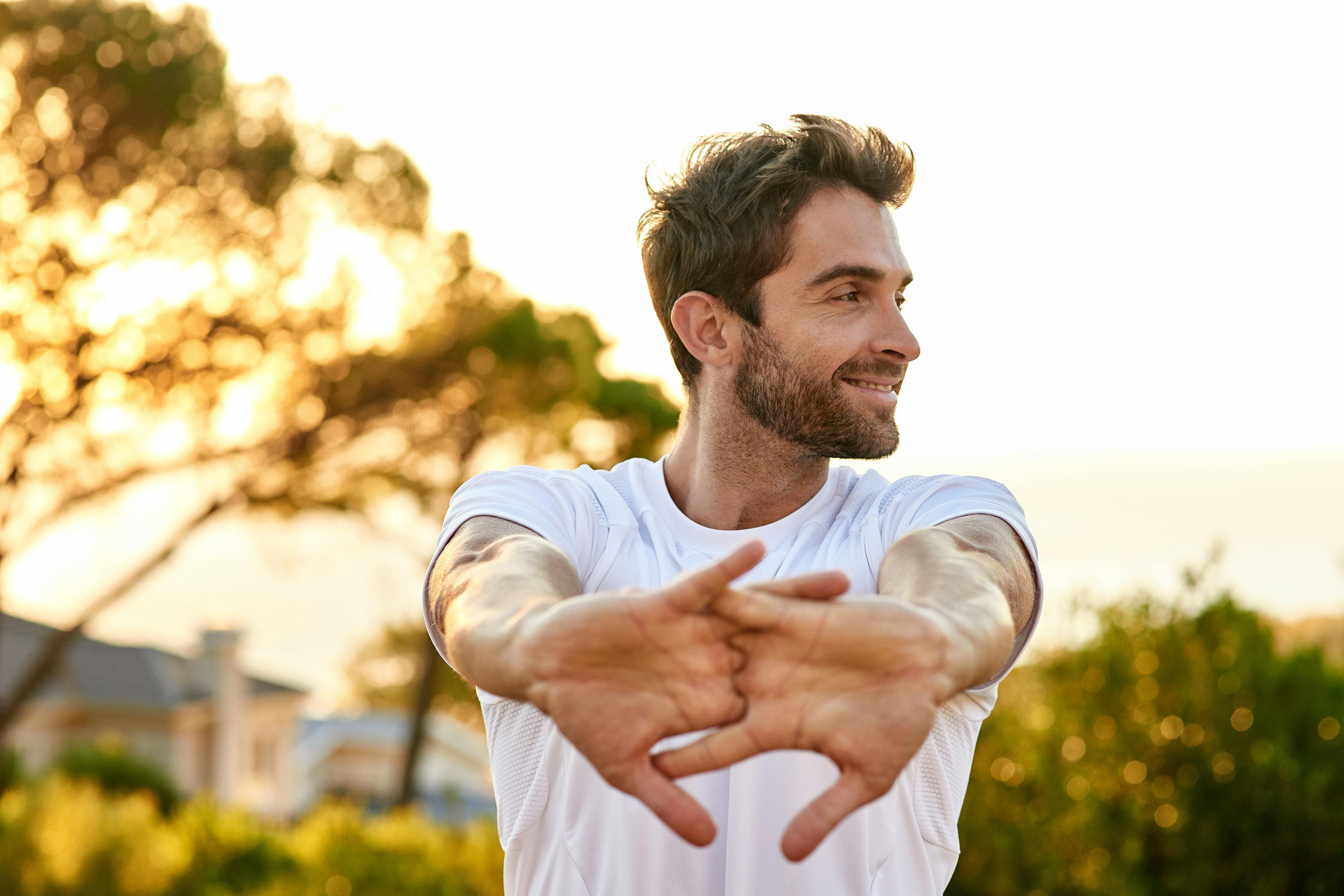 Man stretching his arms before a workout.