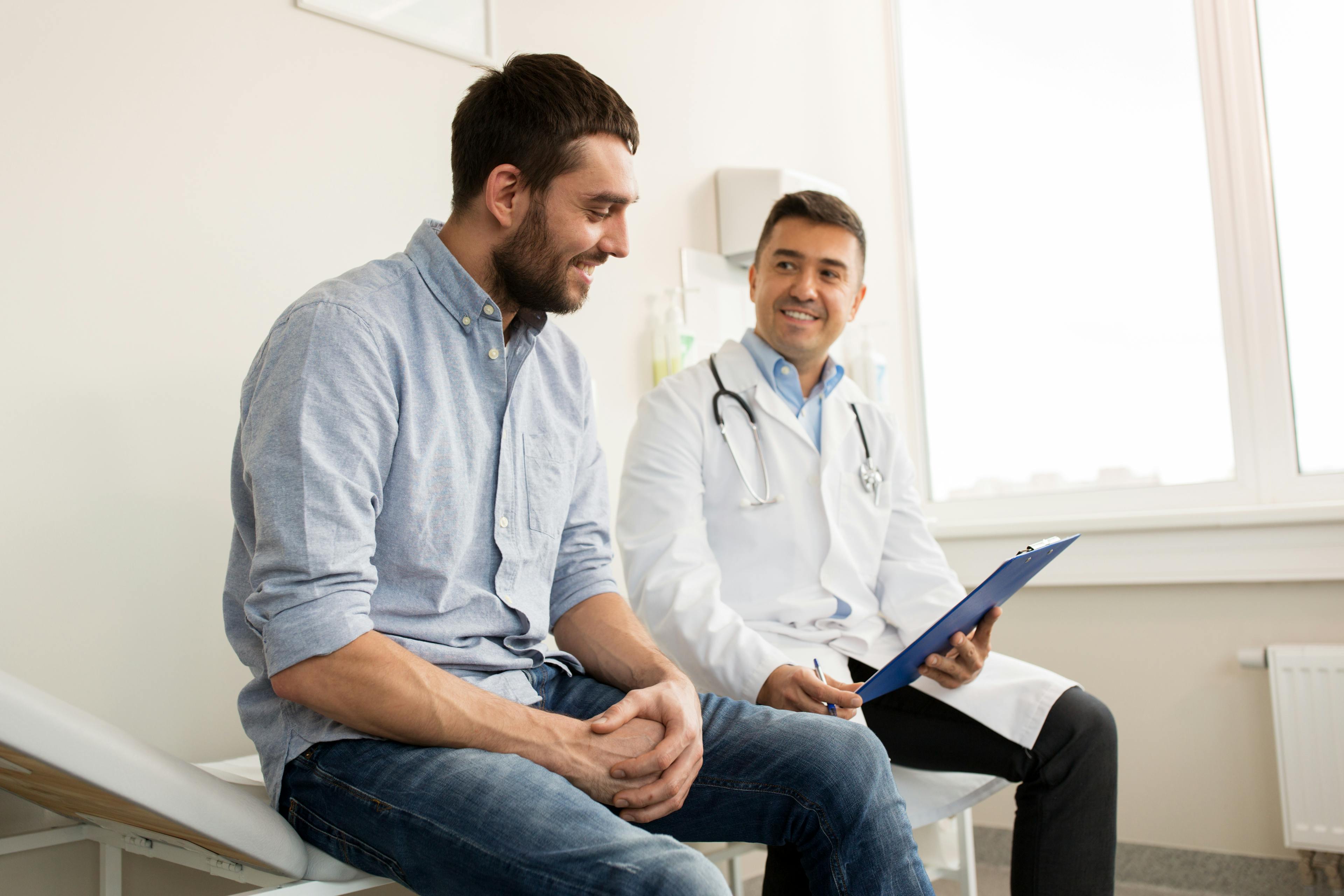 A man consulting with a male doctor.