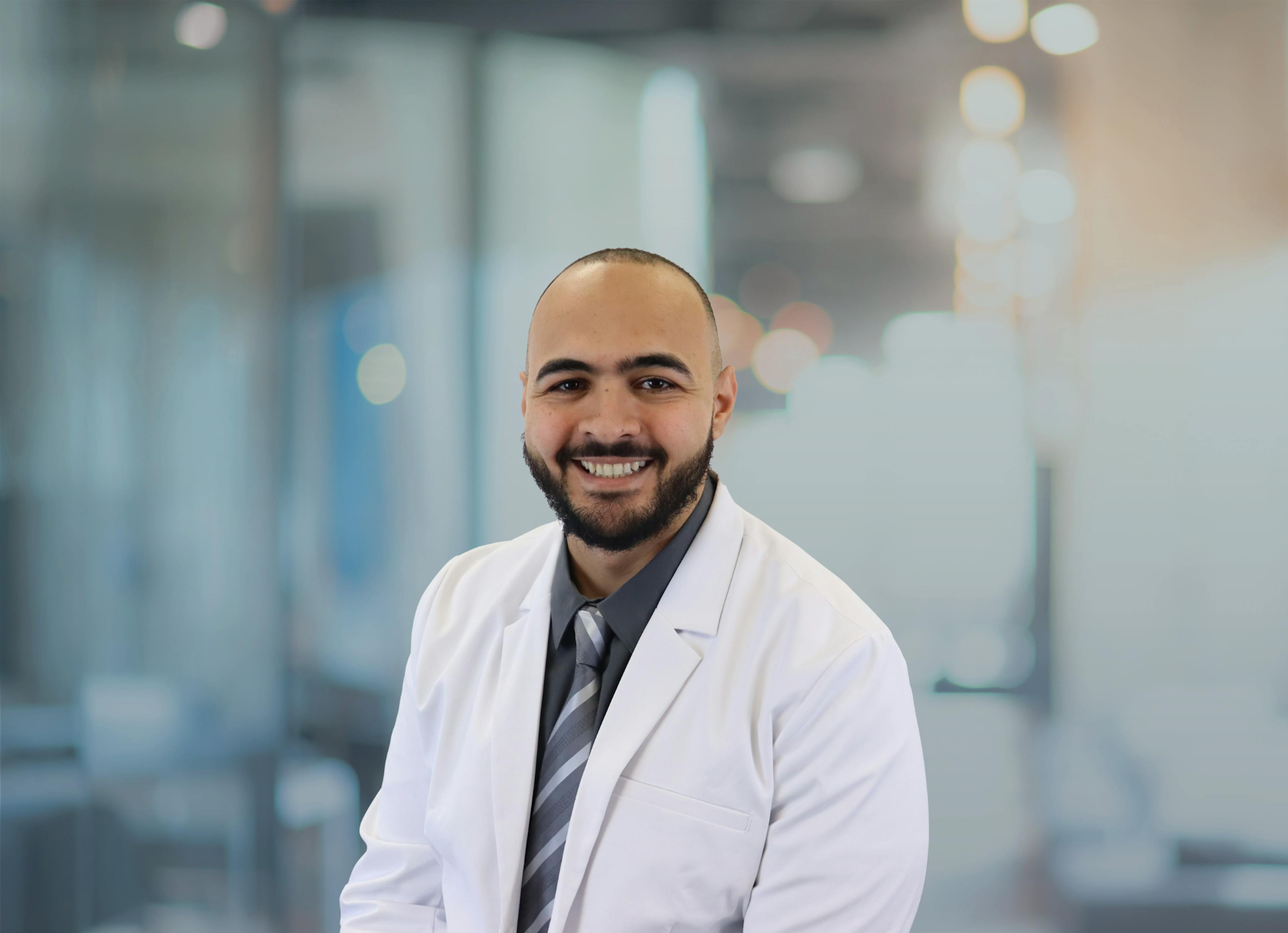 Khaled Attia, MD, pictured in his white coat for a headshot.
