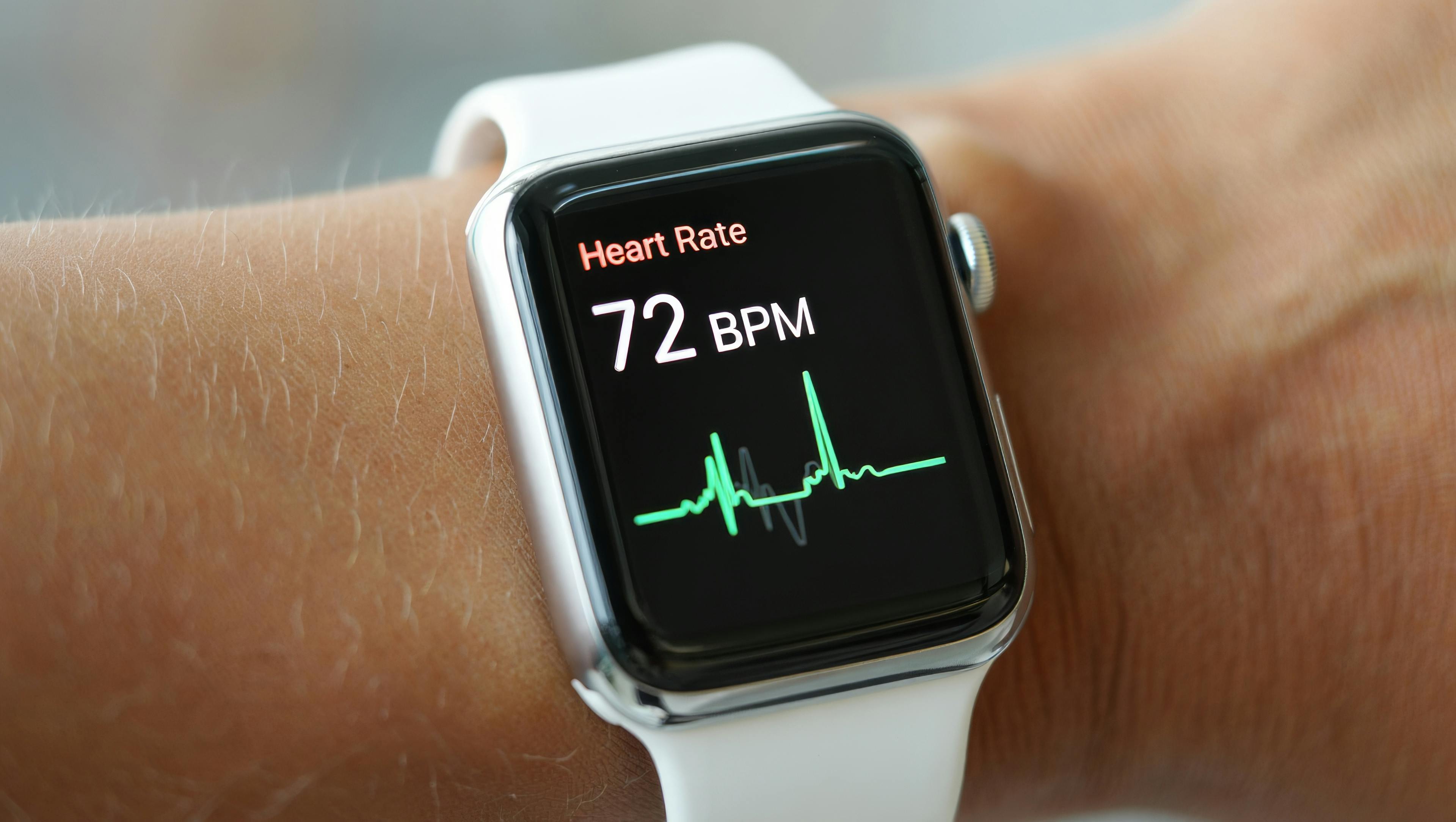 Person with wearable heart rate monitor on their wrist