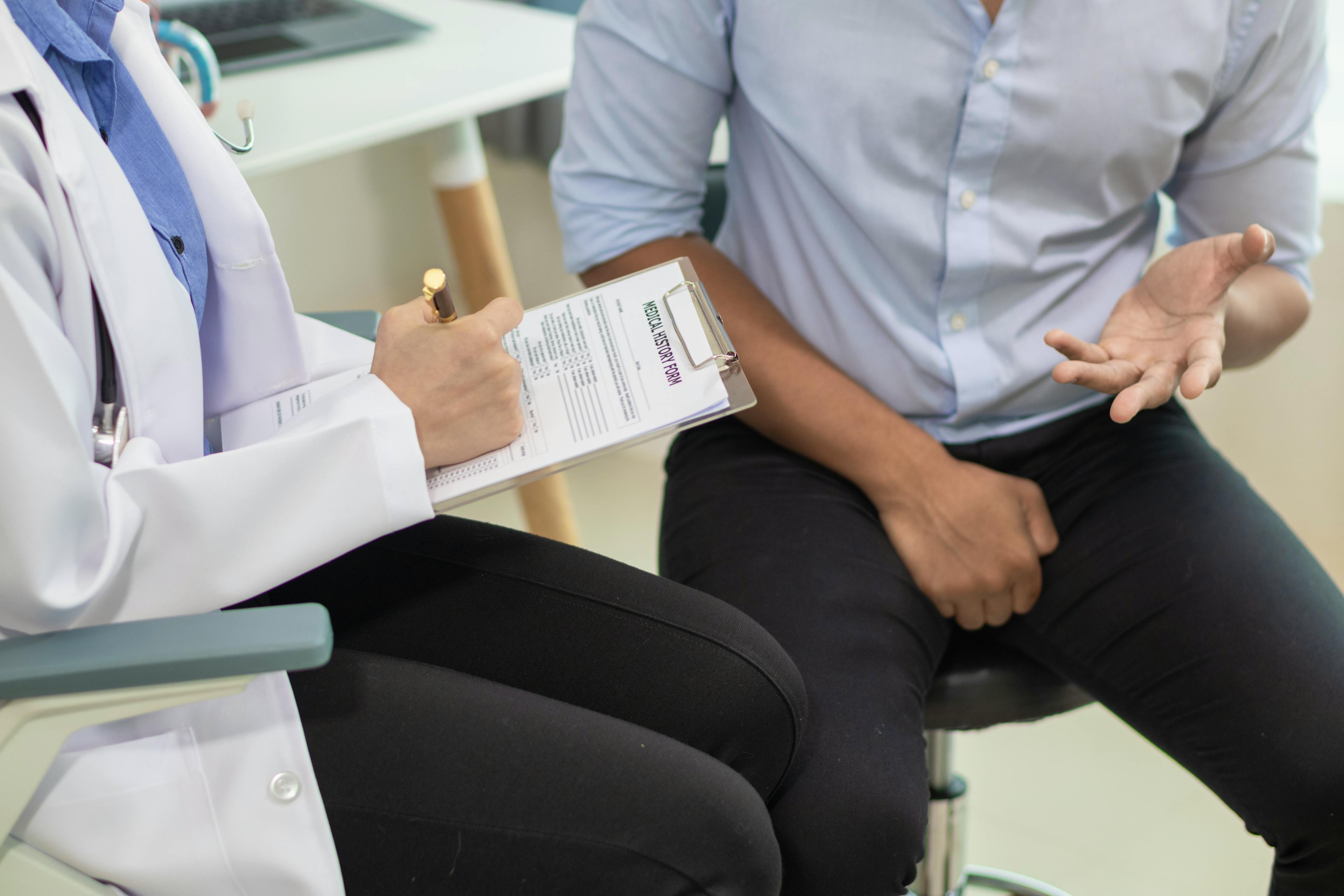 Man talking to a doctor about the Urolift procedure