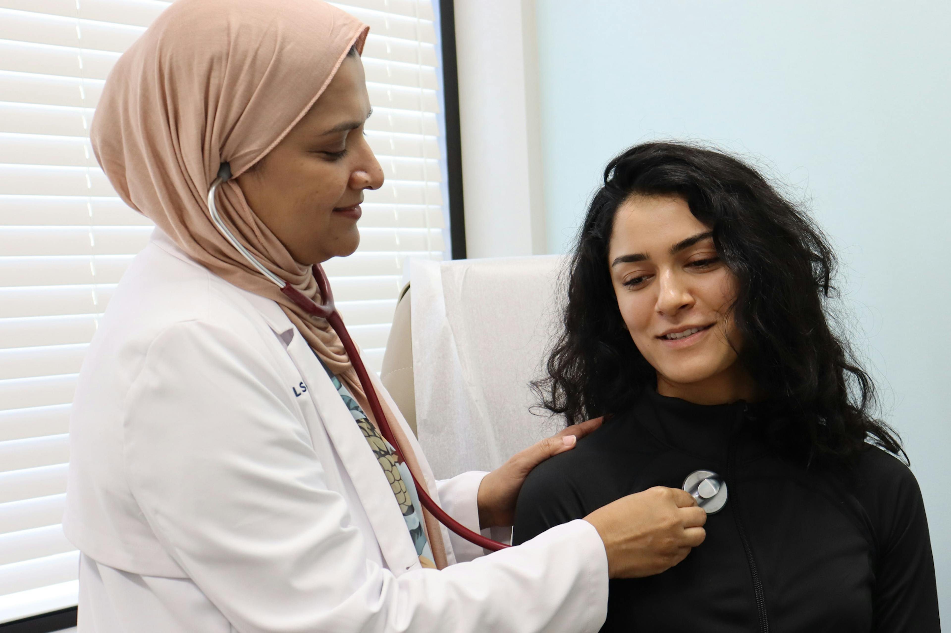 CLS doctor checking heart and lungs of a patient with a stethoscope