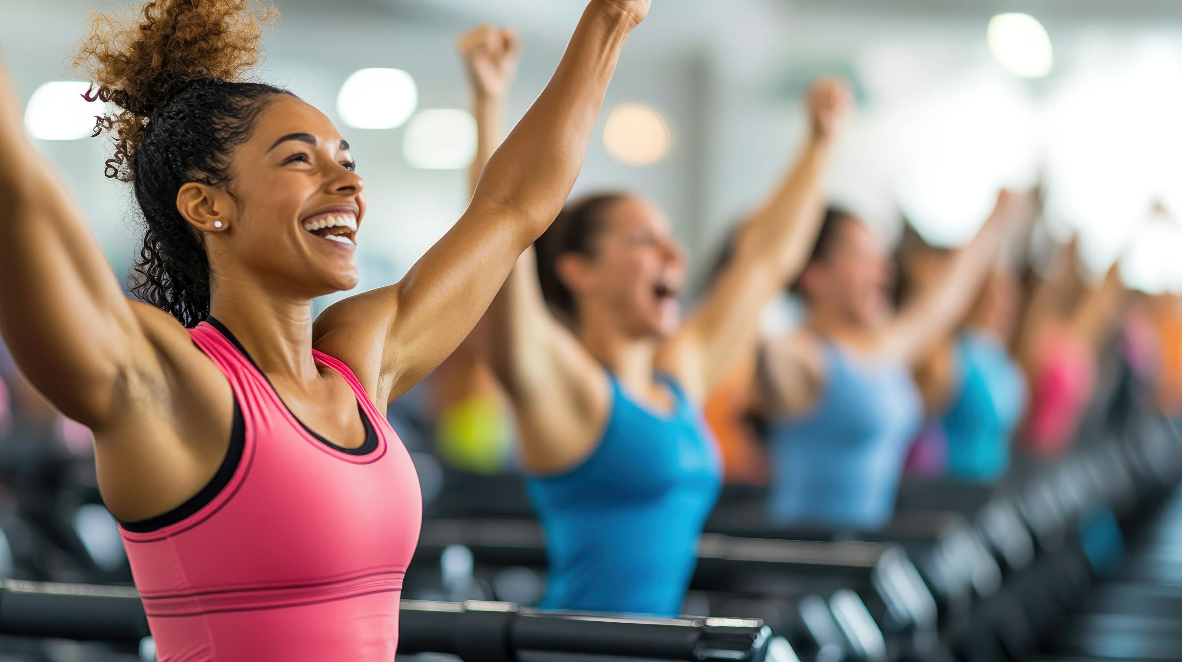 Woman smiles during work out at a fitness class