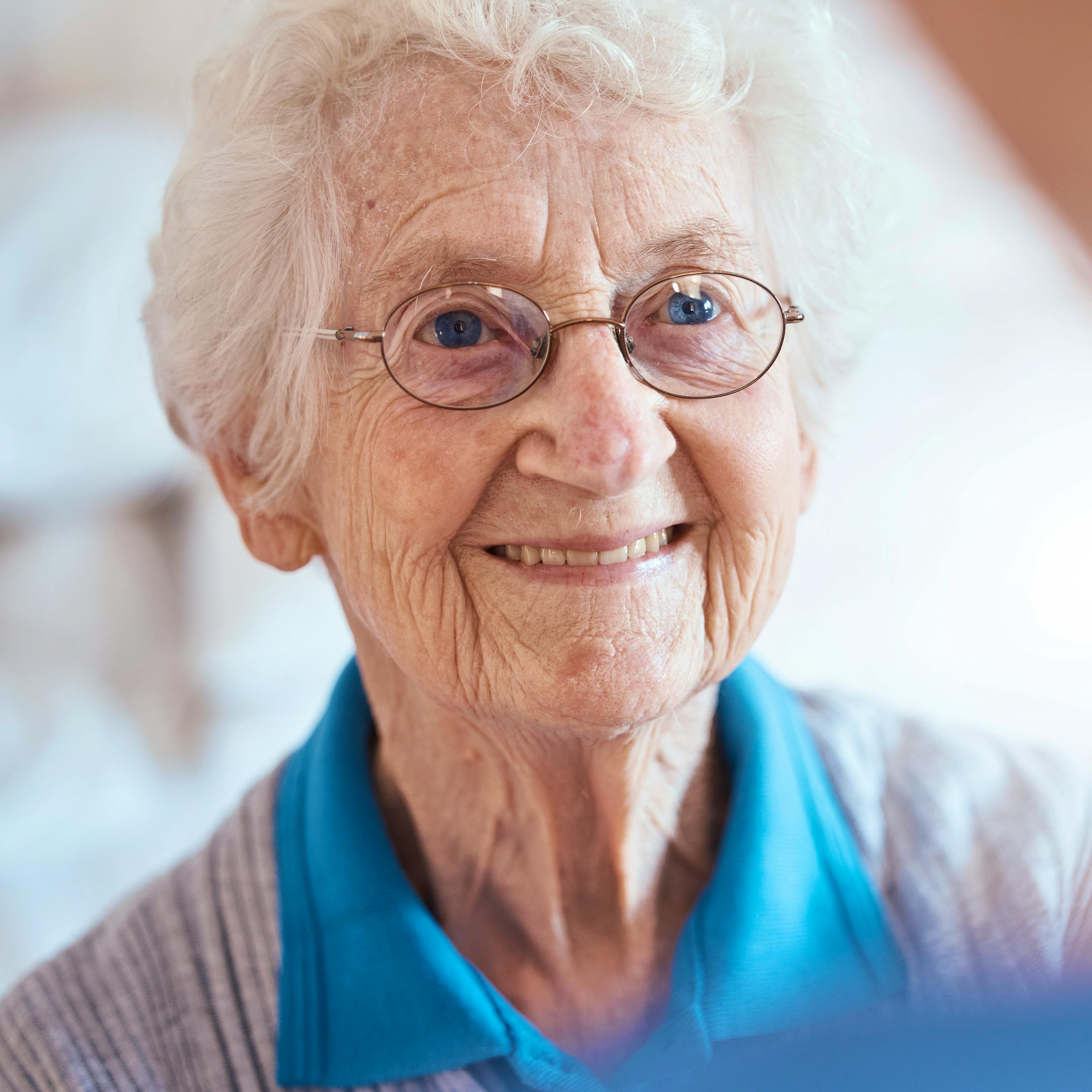 An elderly woman with glaucoma, an eye condition.