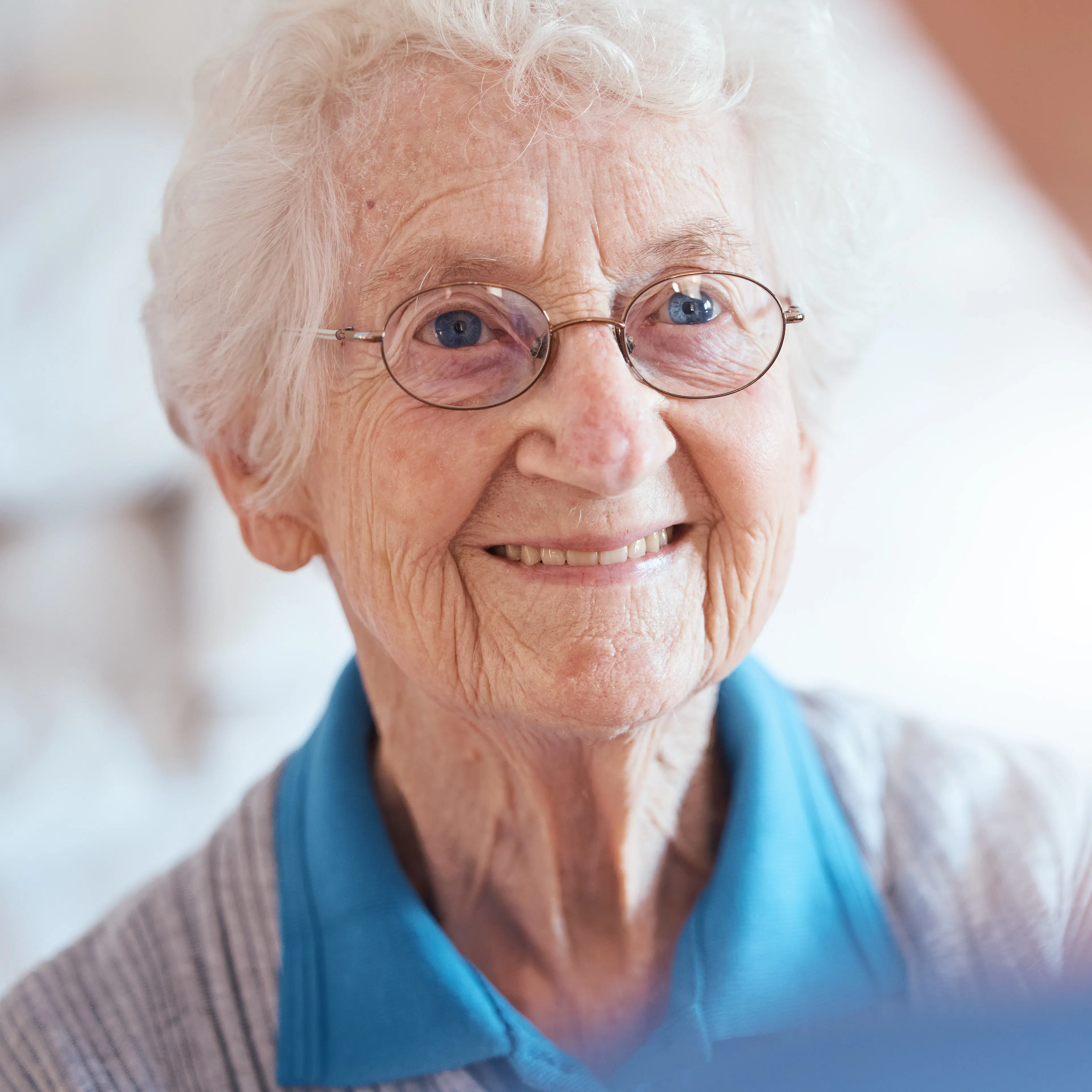 An elderly woman with glaucoma, an eye condition.