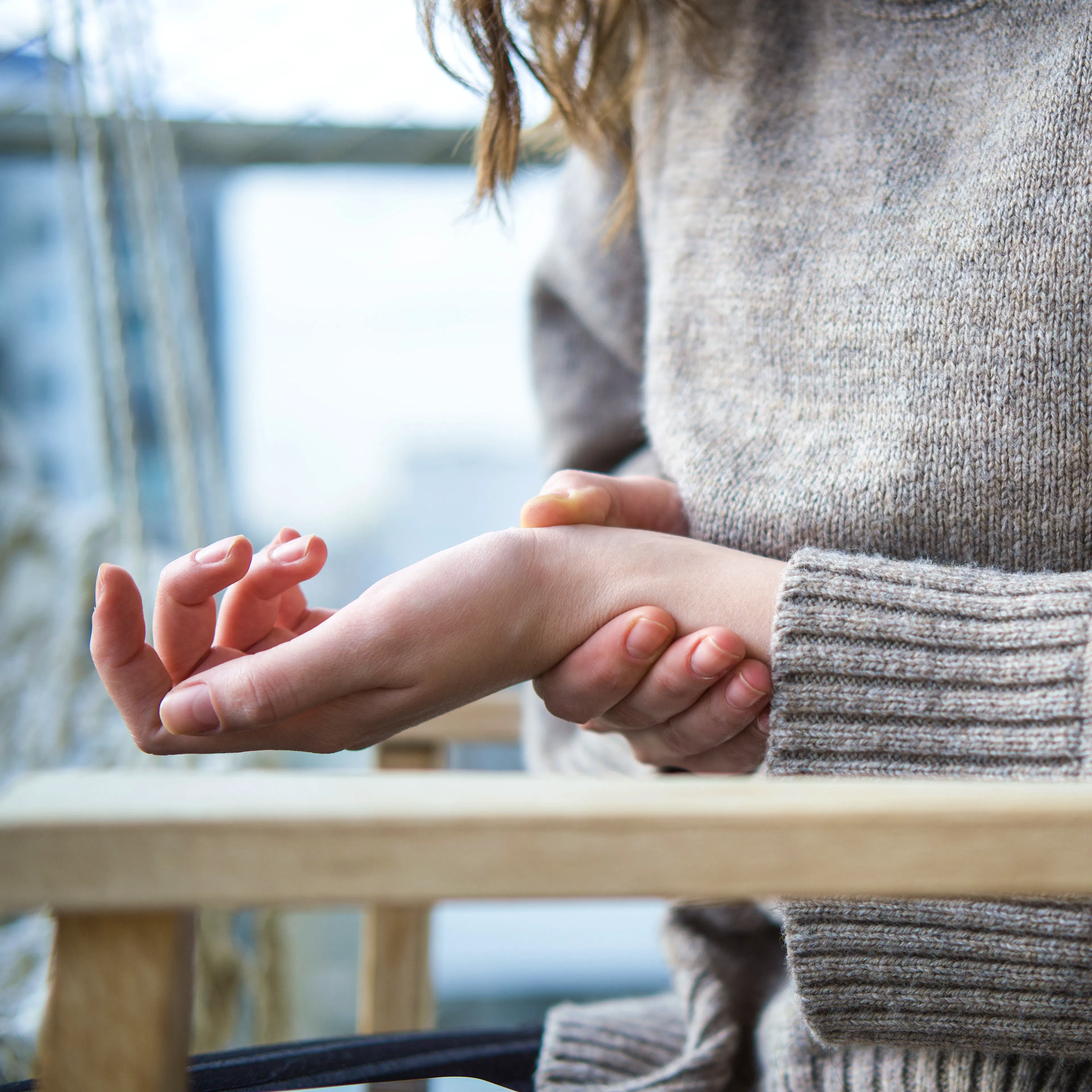 A female is experiencing neuropathy pain in her wrist.
