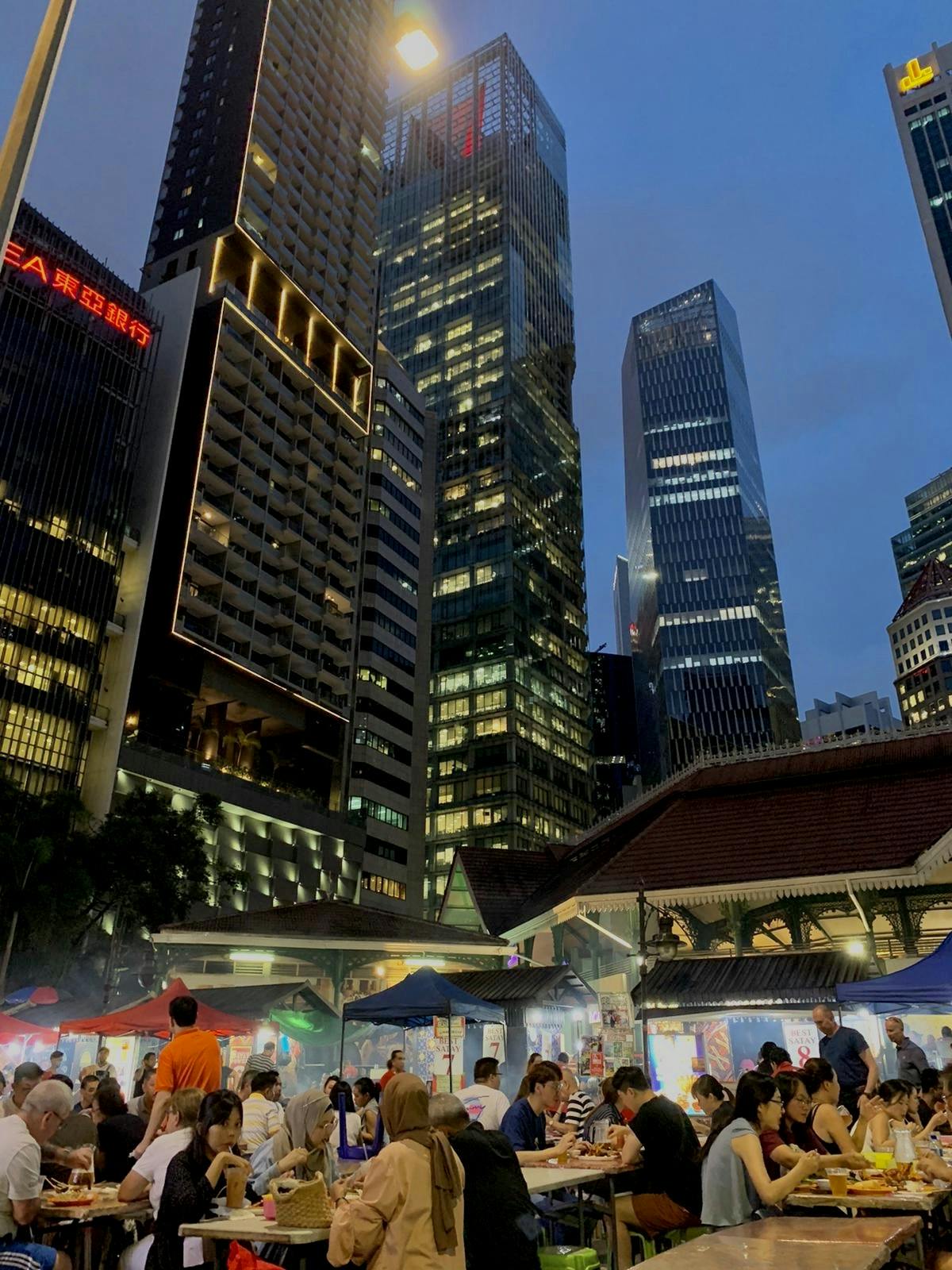 Lau Pa Sat at night, with Casa Mia Robinson Suites in the back