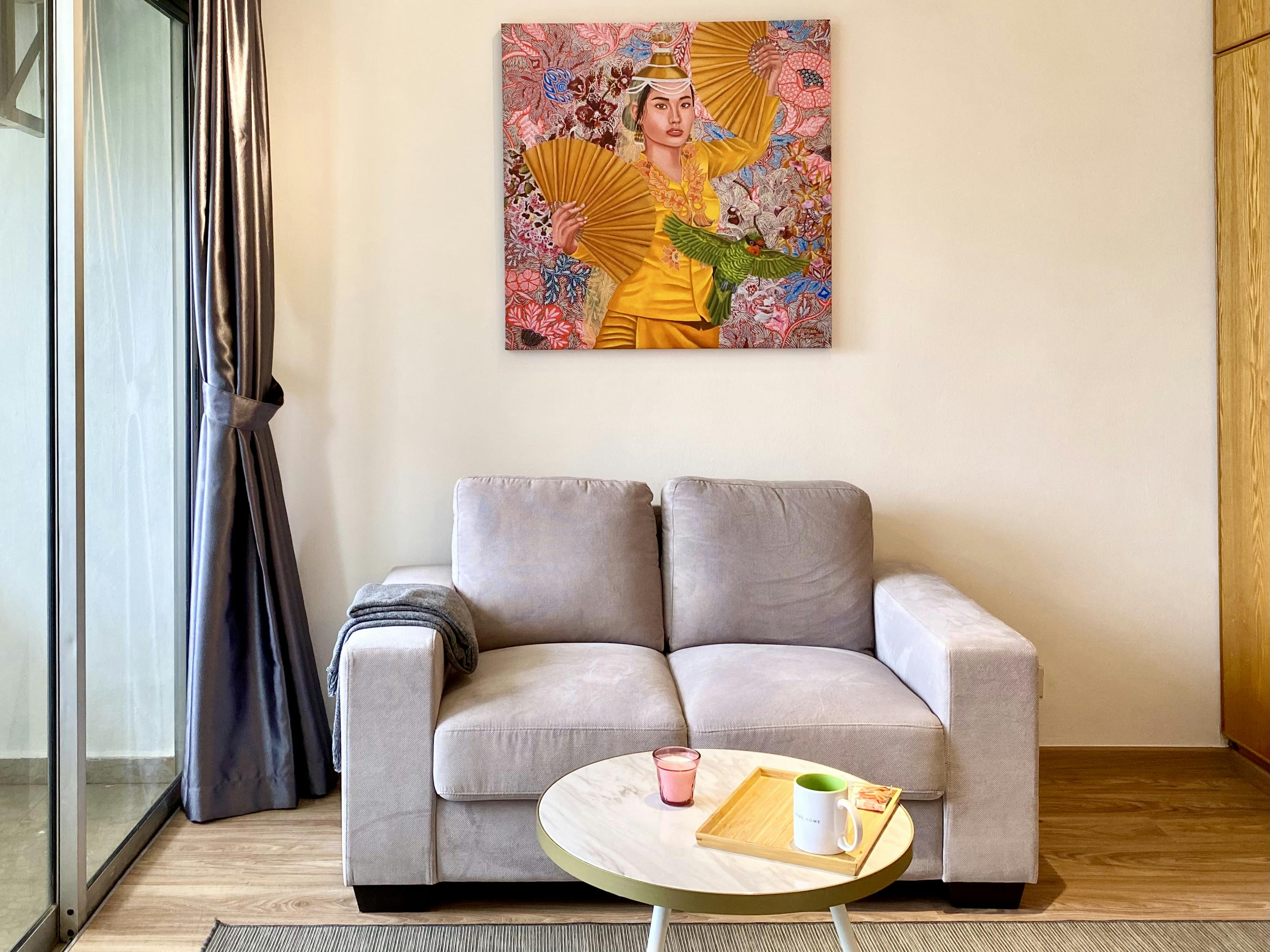 A sofa in the Master bedroom at Casa Mia Elizabeth Heights