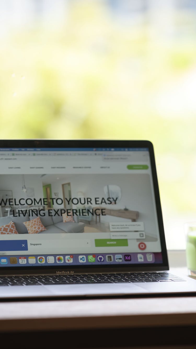 image A laptop with a Casa Mia mug next to it