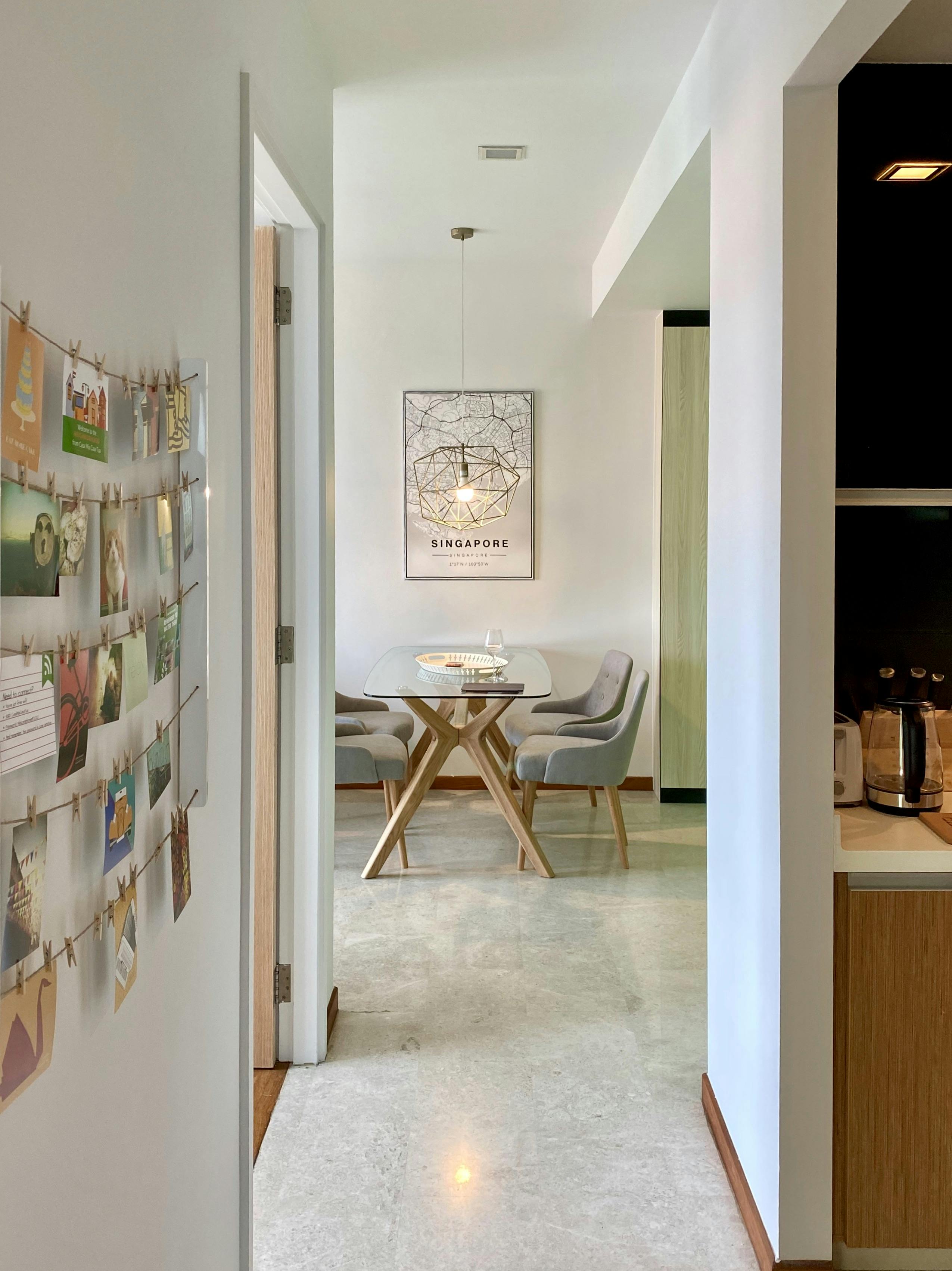 A hallway leading to a dining table