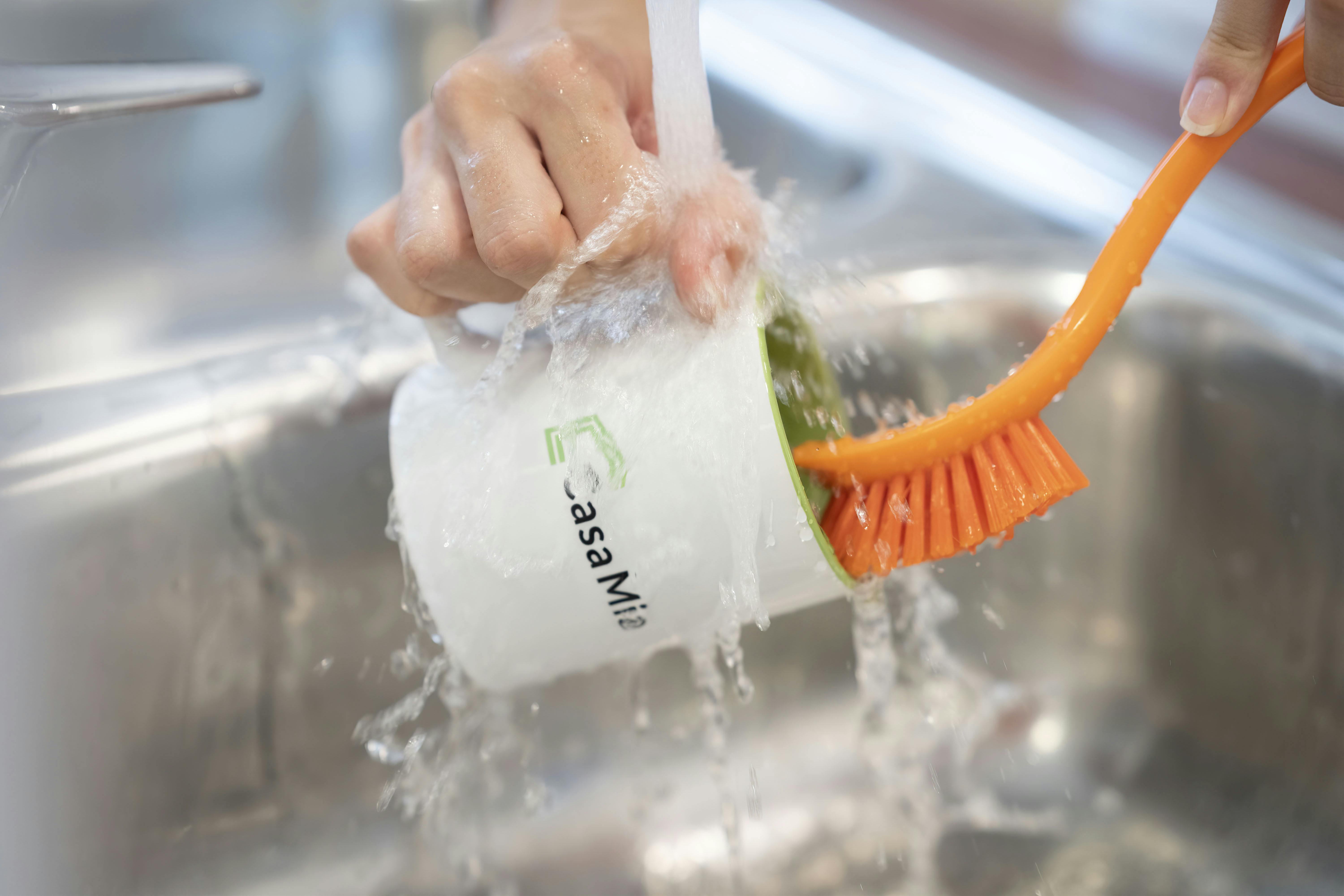 A Casa Mia Coliving mug being washed