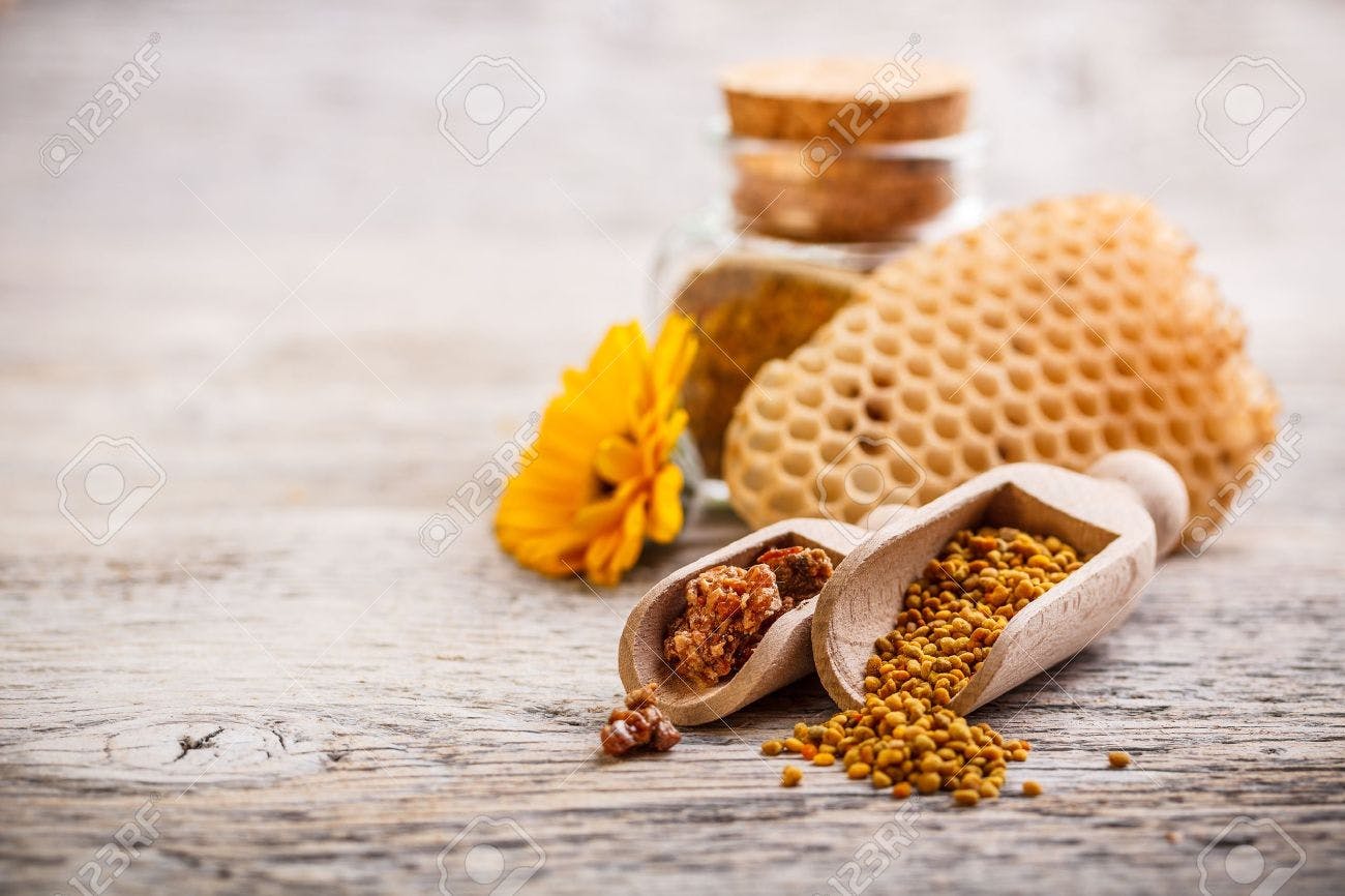 17653058-bee-pollen-granules-and-propolis-in-wooden-scoop