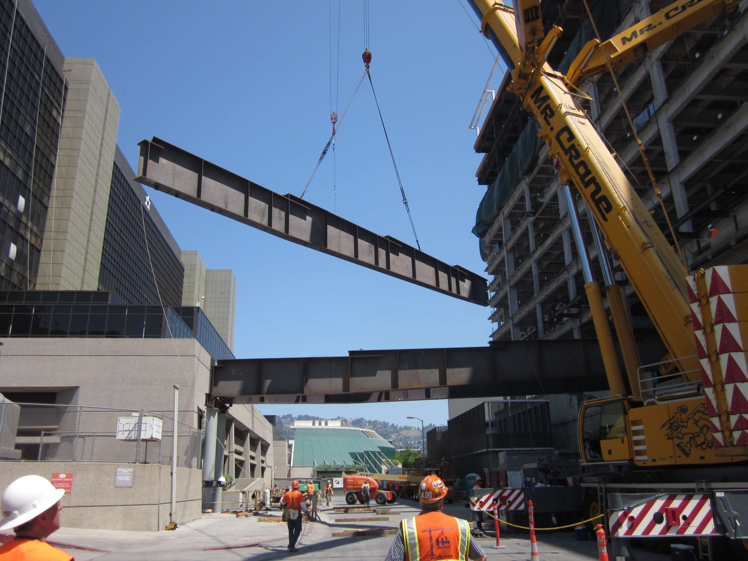 Large steel components being installed as part of a load-bearing structure in California, showcasing galvanizing expertise by Coatinc US.