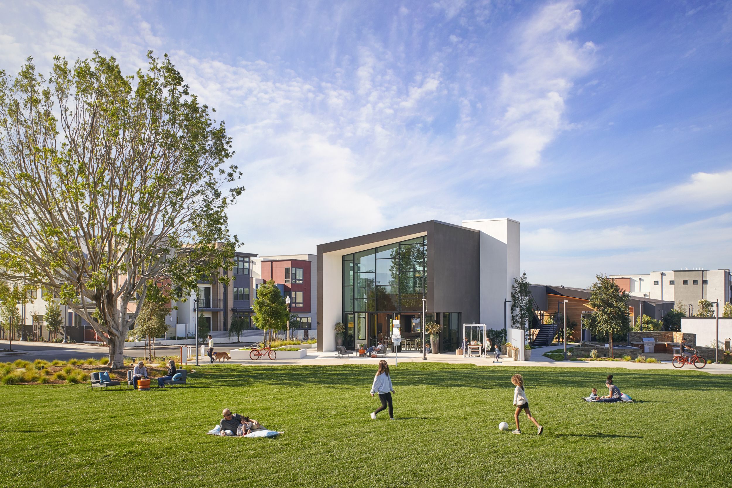 Modern residential areas with apartment buildings and single-family homes featuring galvanized steel elements, showcasing durable corrosion protection by Coatinc US.