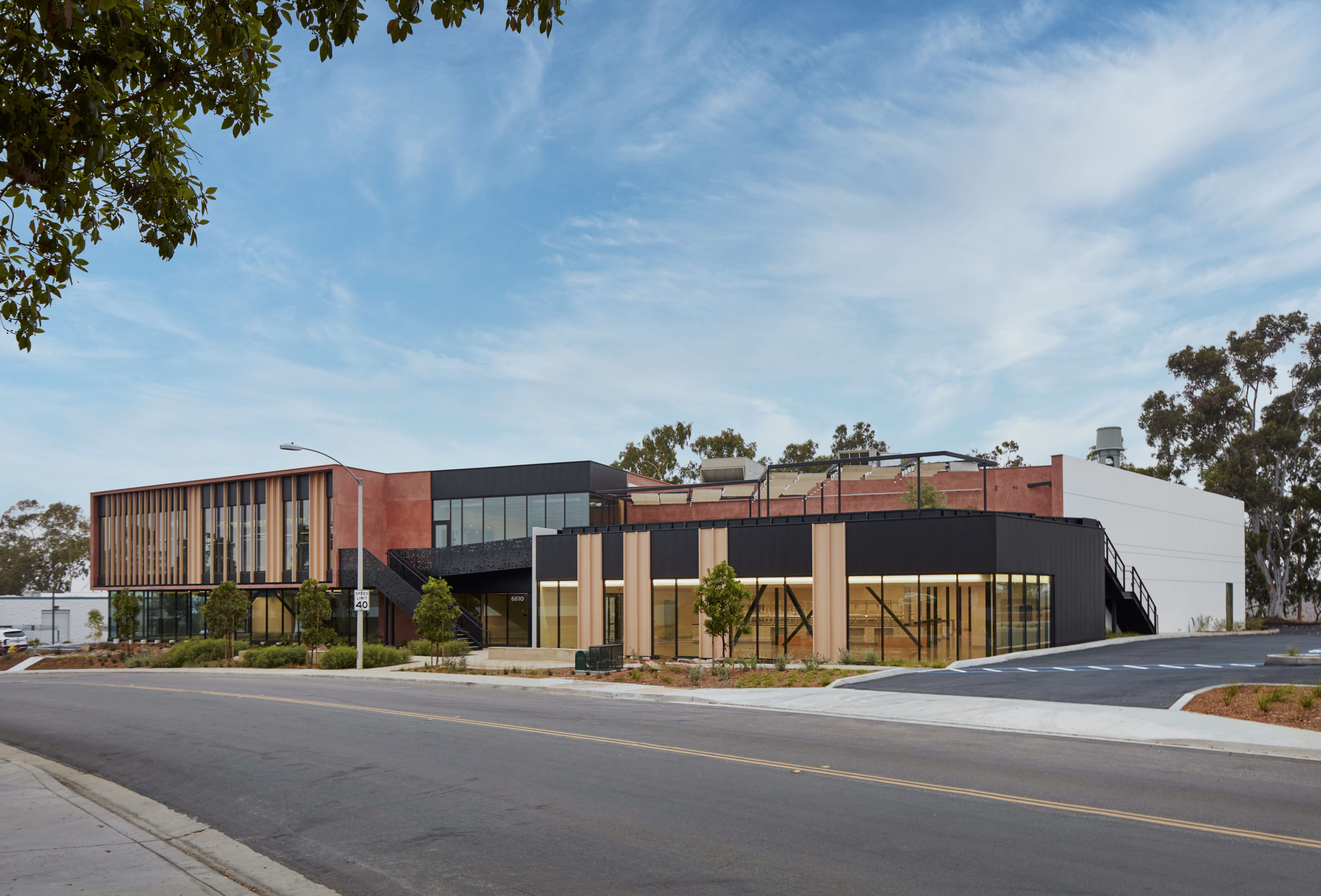 Full view of a building with a large galvanized exterior staircase, showcasing beam galvanizing by Coatinc US for durable, long-term corrosion protection.