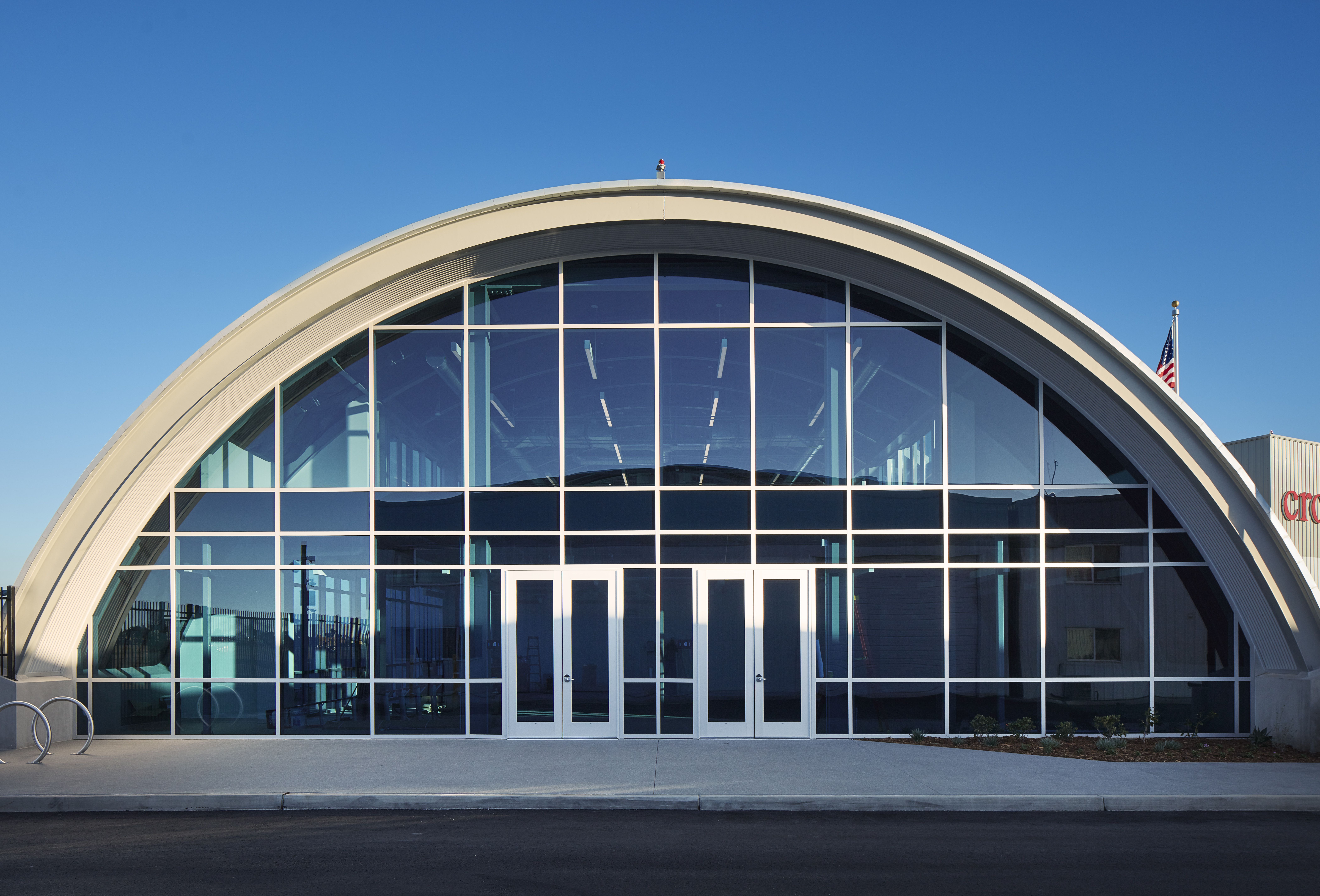 Large entrance forum showcasing steel beams, with the expert team at Coatinc US working on beam galvanizing to ensure durable, high-quality corrosion protection.