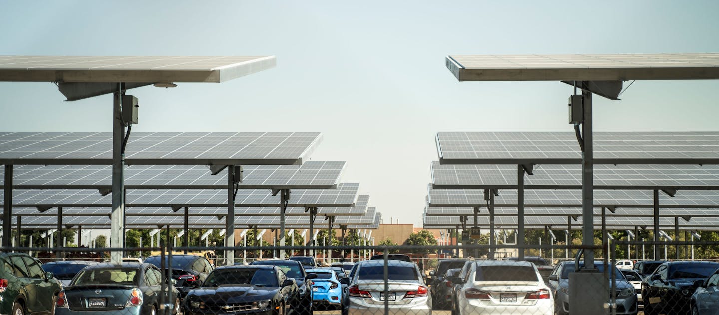 Solar carport canopy supported by galvanized steel structure, showcasing durable corrosion protection by Coatinc US.