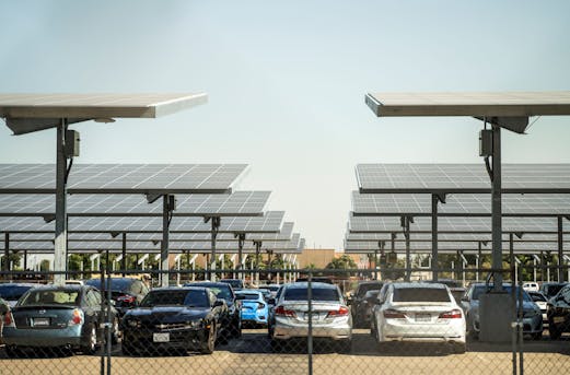 Solar carport canopy supported by galvanized steel structure, showcasing durable corrosion protection by Coatinc US.