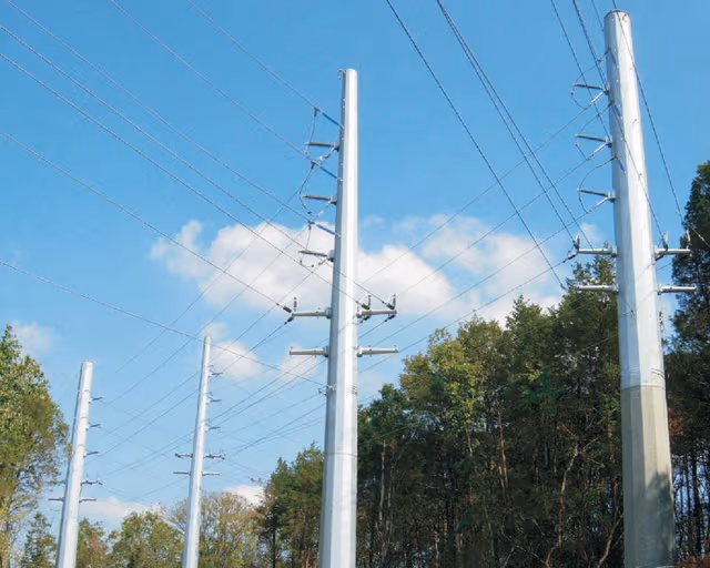 Galvanized steel poles used in power transmission infrastructure, protected with pole galvanizing by Coatinc US to enhance durability, performance, and corrosion resistance.