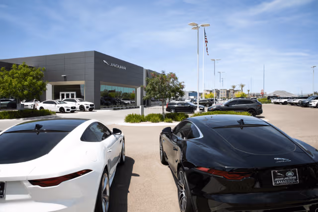 Galvanized lighting poles at a Jaguar facility, protected with pole galvanizing by Coatinc US for long-term durability and corrosion resistance.