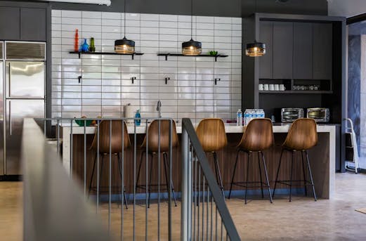 Galvanized steel stair railing in a bar or restaurant, showcasing durable corrosion protection and clean design through galvanizing by Coatinc US in Arizona, Utah, and Nevada.