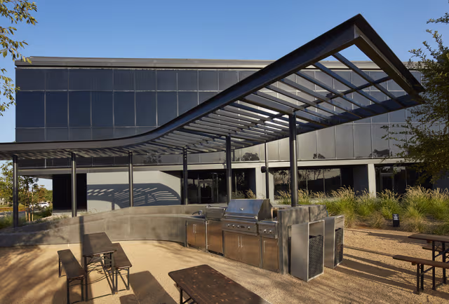 Galvanized steel canopy over an outdoor kitchen and lounge area, showcasing smart corrosion protection by Coatinc US in Arizona, Utah, and Nevada.