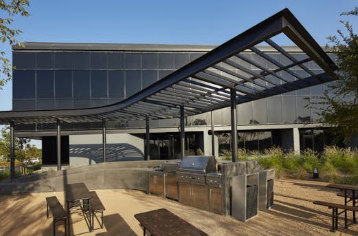 Galvanized steel canopy over an outdoor kitchen and lounge area, showcasing smart corrosion protection by Coatinc US in Arizona, Utah, and Nevada.