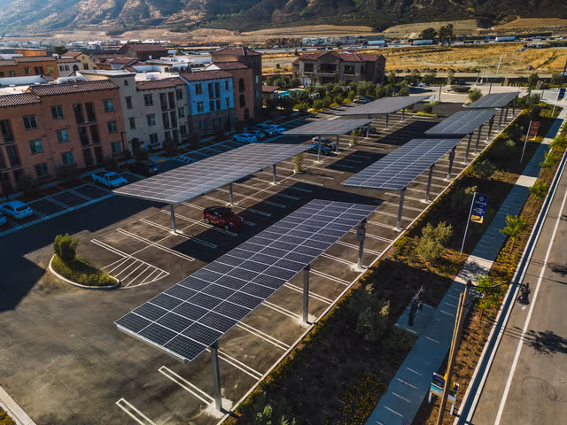Large parking canopies with solar panels mounted on galvanized steel structures, showcasing standout corrosion protection by Coatinc US in Arizona, Utah, and Nevada.