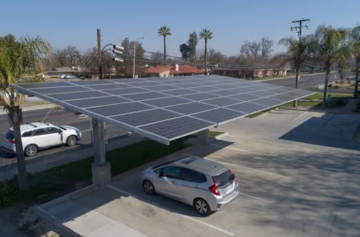 Expansive parking facility featuring solar-equipped carports built on galvanized steel, showcasing the advantages of working with Coatinc US for long-lasting protection.