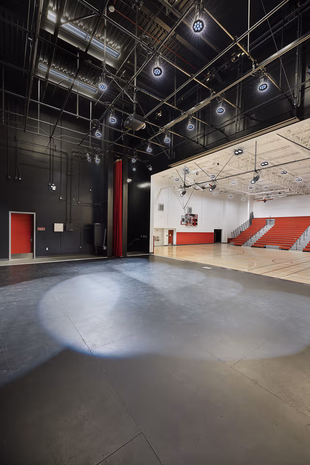 Sports hall featuring various galvanized steel elements, showcasing durable structural components and corrosion protection by Coatinc US.