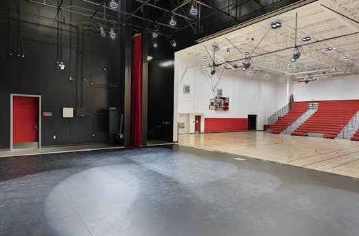 Sports hall featuring various galvanized steel elements, showcasing durable structural components and corrosion protection by Coatinc US.