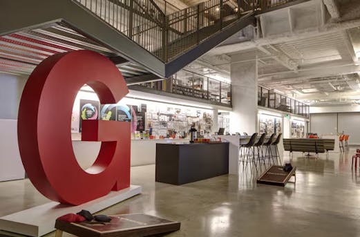 Interior steel construction with ceilings, cross beams, and staircases, showcasing galvanized steel elements for durable structural support by Coatinc US.