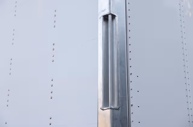 Galvanized steel side panel of a trailer, showcasing durable corrosion protection and long-term performance by Coatinc US.