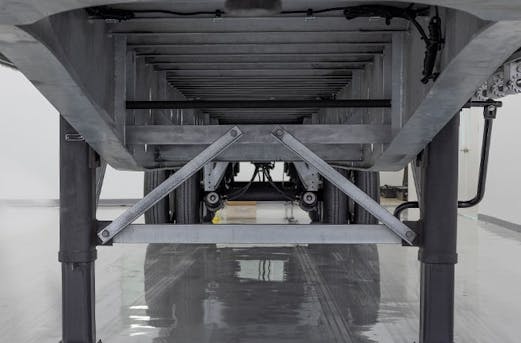 Underside view of a galvanized steel trailer with structural details visible