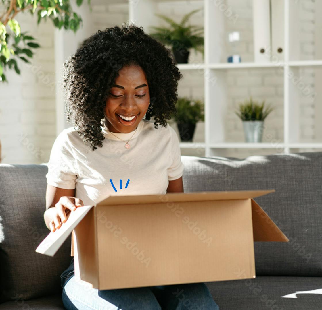 young woman opening a parcel