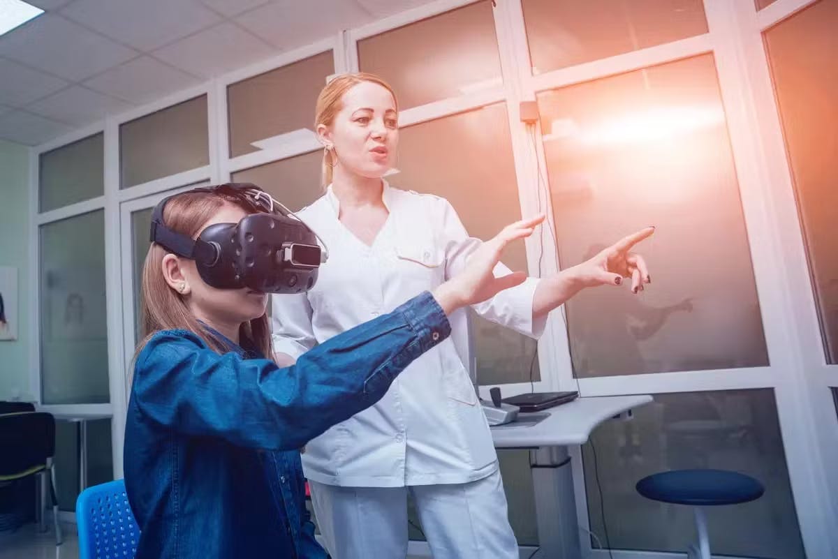 Mother and daughter using virtual reality mask.