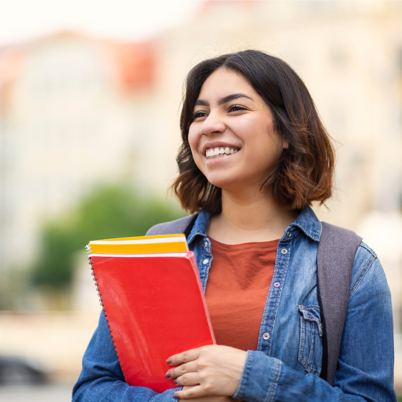 A smiling student managing work life balance