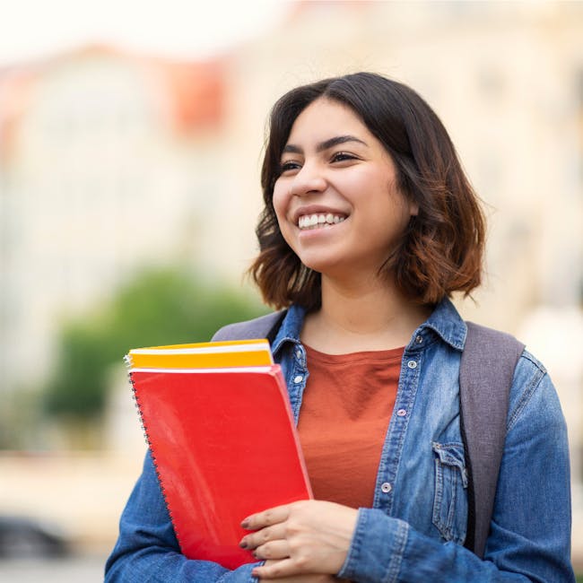 A smiling student managing work life balance