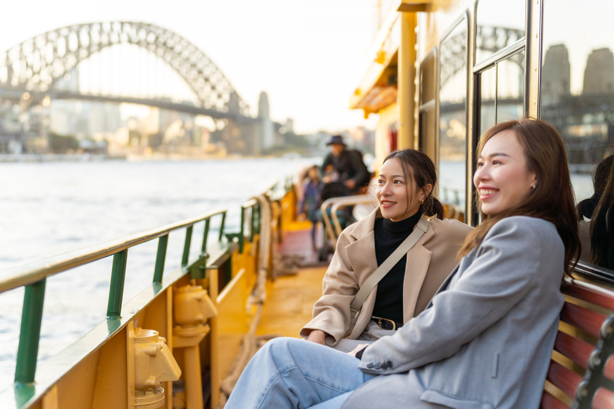 workers who have moved to australia taking a cruise in the Sydney Harbour