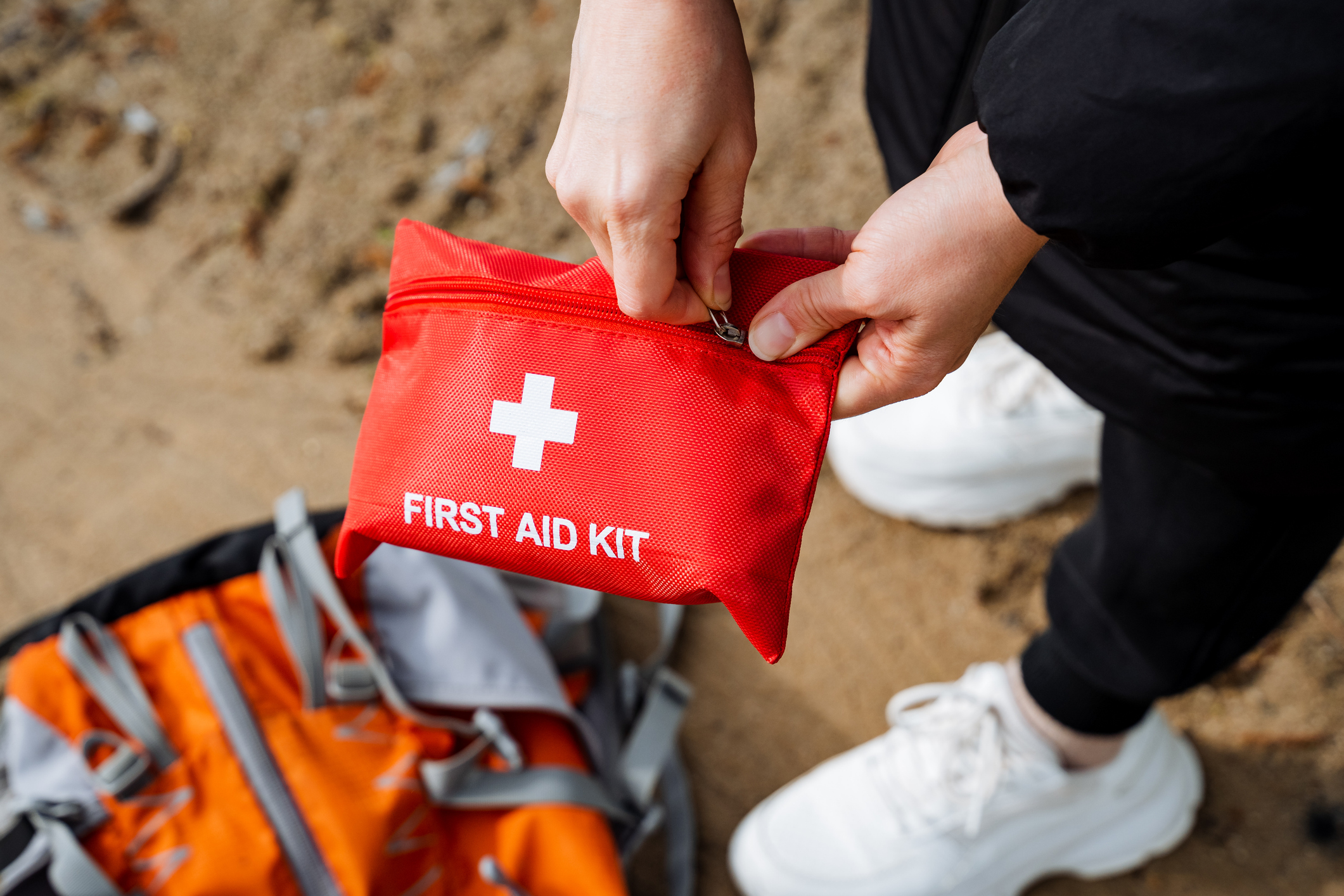 Someone using a First Aid Kit