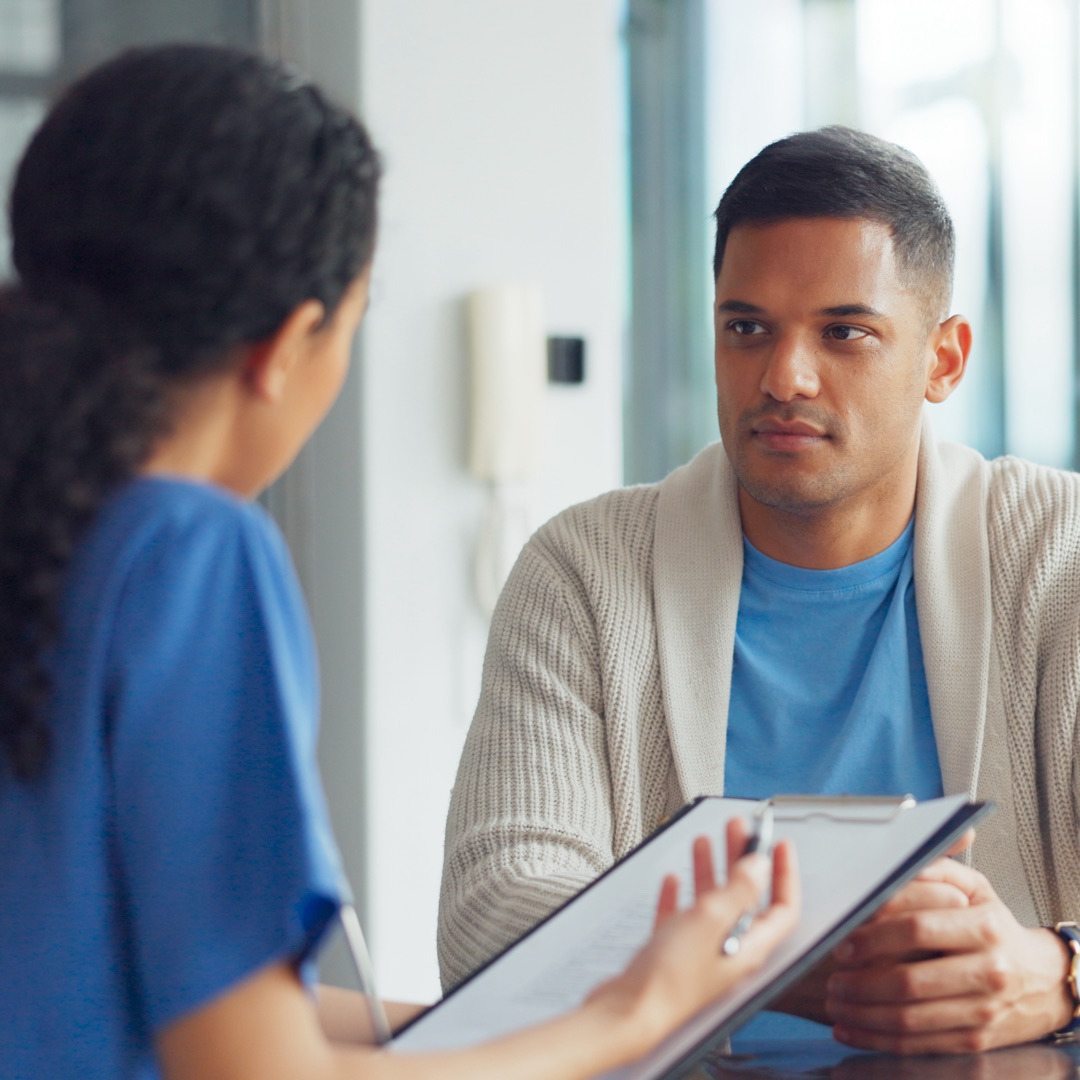 A nurse review medical cover with an Australian overseas student.