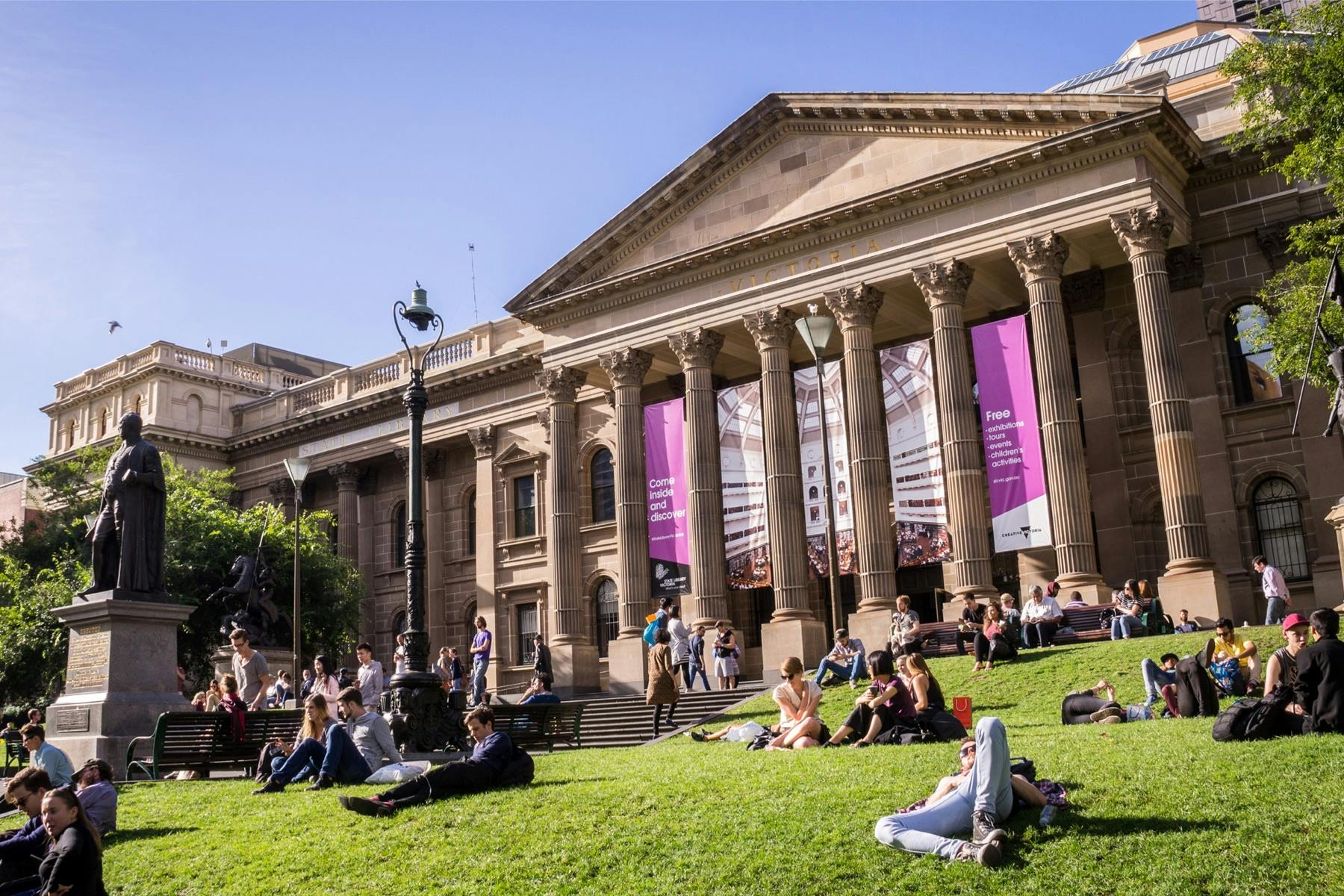 Students relaxing on the lawn of an Australian university. 