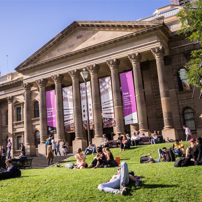 Students relaxing on the lawn of an Australian university.