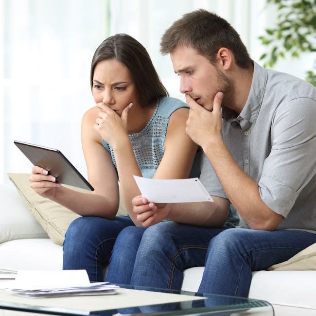 a couple comparing OSHC insuance online